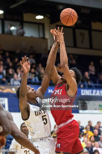 Kent State Golden Flashes F Danny Pippen defends the shot attempt of Miami RedHawks F Marcus Weathers first half of the men's college basketball game...