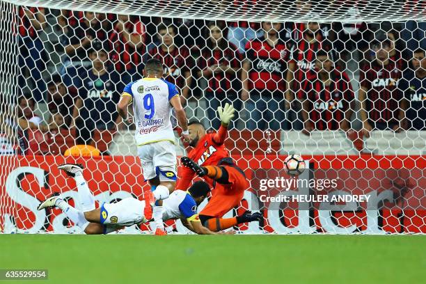 Gustavo Noguera of Paraguay's Deportivo Capiata scores against Brazil's Atletico Paranaense during their Libertadores Cup football match at the Arena...