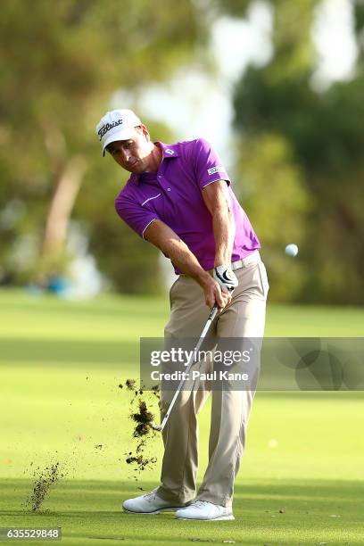 Brett Rumford of Australia plays his approach shot on the 13th hole during round one of the ISPS HANDA World Super 6 at Lake Karrinyup Country Club...