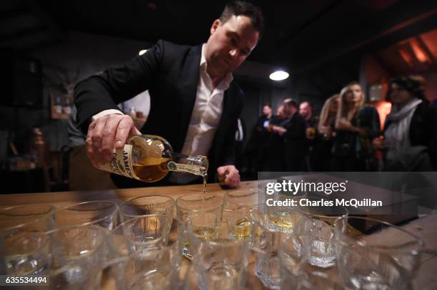 Participants of the Dublin Tech Summit take part in a whiskey tasting demonstration at the Irish Whiskey Museum on February 15, 2017 in Dublin,...