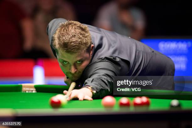 Michael White of Wales plays a shot in his second round match against Liang Wenbo of China on day three of the 2017 Coral Welsh Open at the...