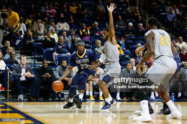 Kent State Golden Flashes guard Jaylin Walker drives to the basket against Toledo Rockets guard Jonathan Williams during a regular season basketball...