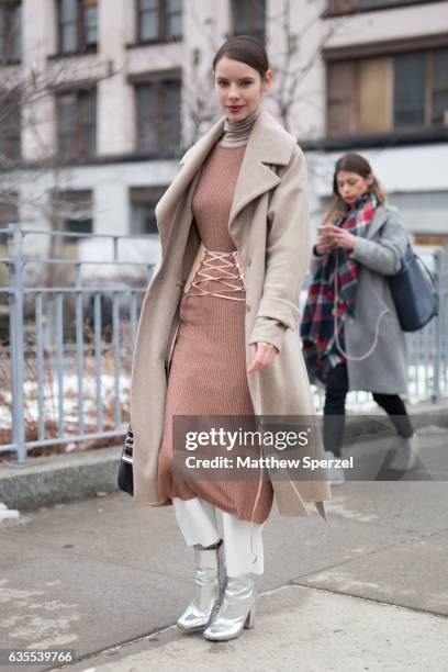 Marina Ingvarsson is seen attending Michael Kors during New York Fashion Week wearing a tan coat and dress with silver shoes on February 15, 2017 in...
