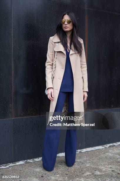 Jessica Gomez is seen attending Michael Kors during New York Fashion Week wearing a tan wool coat with navy outfit on February 15, 2017 in New York...