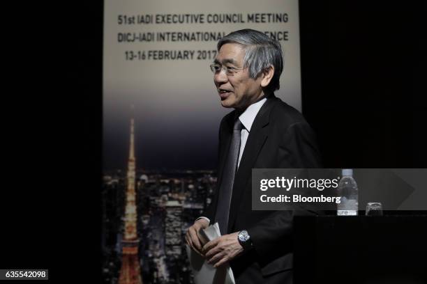 Haruhiko Kuroda, governor of the Bank of Japan , leaves after delivering a keynote speech at an international conference hosted by the Deposit...