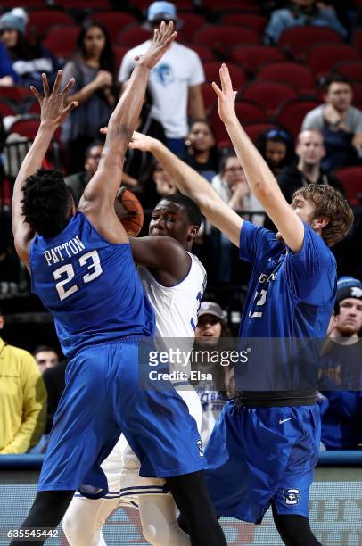 Sam Dunkum of the Creighton Bluejays is surrounded by Justin Patton and Toby Hegner of the Creighton Bluejays in the firs thalf on February 15, 2017...