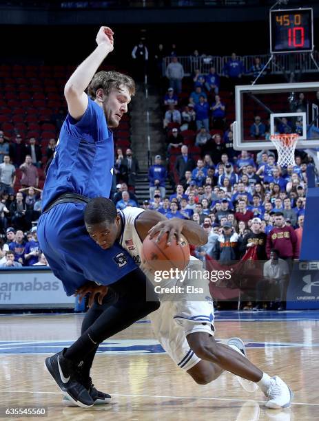 Toby Hegner of the Creighton Bluejays tries to stop Khadeen Carrington of the Seton Hall Pirates as he drives by in the second half on February 15,...