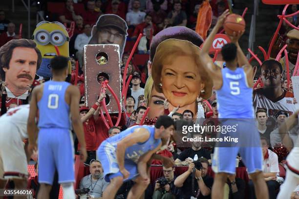 Fans of the North Carolina State Wolfpack try to distract Tony Bradley of the North Carolina Tar Heels at PNC Arena on February 15, 2017 in Raleigh,...