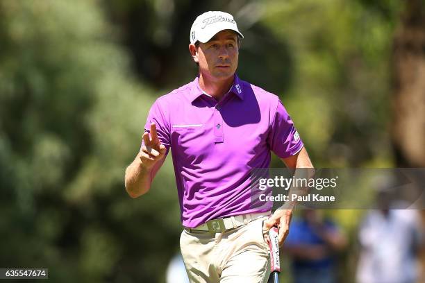 Brett Rumford of Australia acknowledges the gallery on the 7th green during round one of the ISPS HANDA World Super 6 at Lake Karrinyup Country Club...