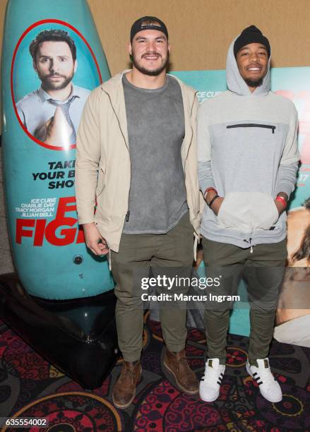 Professional football players Adam Gotsis and DeAndre Smelter attend FIST FIGHT VIP screening with a special apperance by star Ice Cube at Regal...