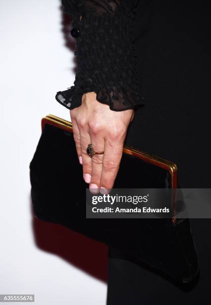 Actress Julianna Guill, clutch detail, arrives at the premiere of Momentum Pictures' "In Dubious Battle" at ArcLight Hollywood on February 15, 2017...