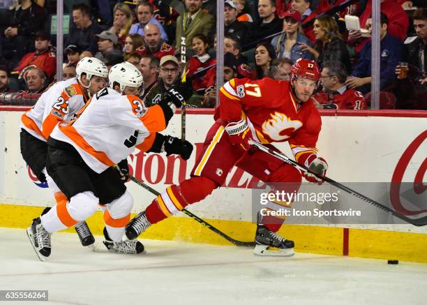 Philadelphia Flyers Defenceman Brandon Manning and Philadelphia Flyers Defenceman Radko Gudas chase Calgary Flames Left Wing Lance Bouma during a...