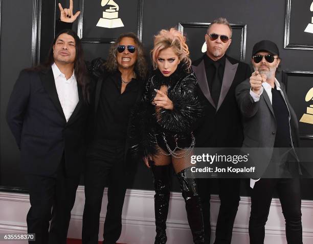 Recording artist Lady Gaga and recording artists Robert Trujillo, Kirk Hammett, James Hetfield, and Lars Ulrich of music group Metallica arrive at...