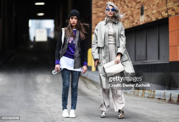 Thania Peck and Samantha Angelo are seen outside the Anna Sui show during New York Fashion Week on February 15, 2017 in New York City.