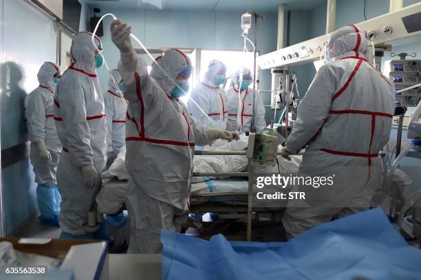 This photo taken on February 12, 2017 shows an H7N9 bird flu patient being treated in a hospital in Wuhan, central China's Hubei province. China is...