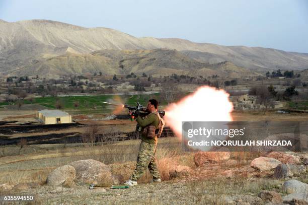 Member of the Afghan security force fires a rocket-propelled grenade launcher during an ongoing an operation against Islamic State militants in Kot...