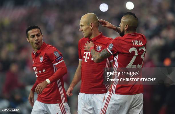 Bayern Munich's Spanish midfielder Thiago Alcantara, Bayern Munich's Dutch midfielder Arjen Robben and Bayern Munich's Chilian midfielder Arturo...