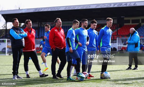Pundits Paul Merson and Matt Le Tissier take part in a training session alongside Paul Doswell manager of Sutton United and players during a Sutton...