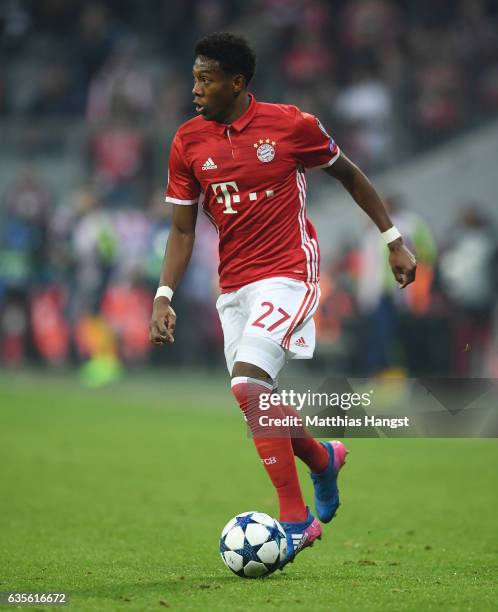 David Alaba of FC Bayern Muenchen controls the ball during the UEFA Champions League Round of 16 first leg match between FC Bayern Muenchen and...