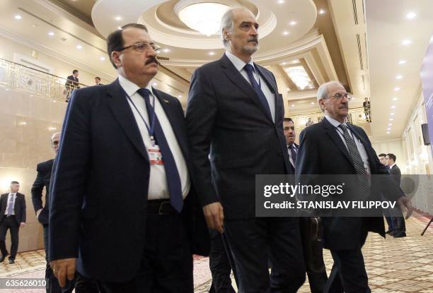 Syria's UN ambassador and head of the government delegation Bashar al-Jaafari and Syrian ambassador to Russia Riad Haddad arrive prior to the second...