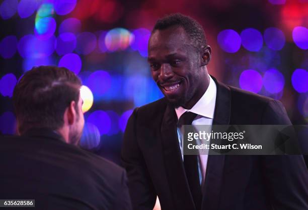 Laureus World Sportsman of the Year Award winner Usain Bolt of Jamaica shakes hands with Laureus World Comeback of the Year Award winner Michael...