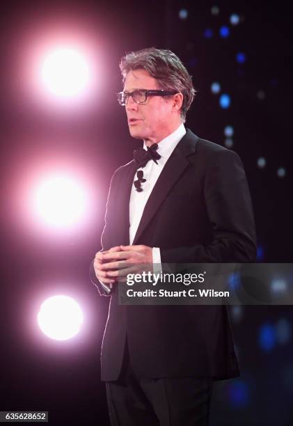 Host Hugh Grant talks on stage during the 2017 Laureus World Sports Awards at the Salle des Etoiles,Sporting Monte Carlo on February 14, 2017 in...