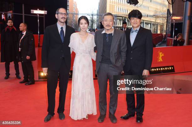 Mark Peranson, actress Kim Min-hee, director Hong Sang-soo and Park Hong-Yeol attend the 'On the Beach at Night Alone' premiere during the 67th...