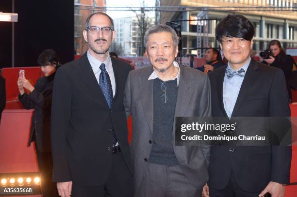 Mark Peranson,director Hong Sang-soo and Park Hong-Yeol attend the 'On the Beach at Night Alone' premiere during the 67th Berlinale International...