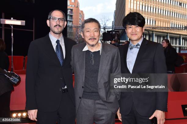 Mark Peranson,director Hong Sang-soo and Park Hong-Yeol attend the 'On the Beach at Night Alone' premiere during the 67th Berlinale International...