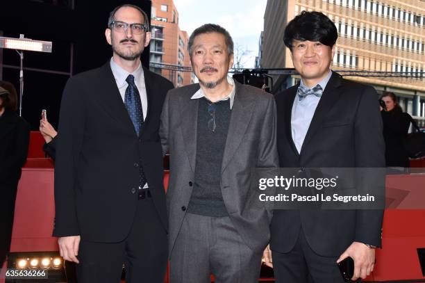 Mark Peranson,director Hong Sang-soo and Park Hong-Yeol attend the 'On the Beach at Night Alone' premiere during the 67th Berlinale International...