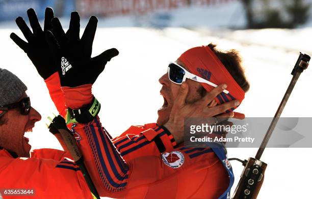 Lowell Bailey of the USA celebrates with his coach Bernd Eisenbichler after winning the Gold medal in the Men's 20km Individual competition of the...
