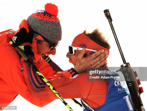 Lowell Bailey of the USA celebrates with his coach Bernd Eisenbichler after winning the Gold medal in the Men's 20km Individual competition of the...