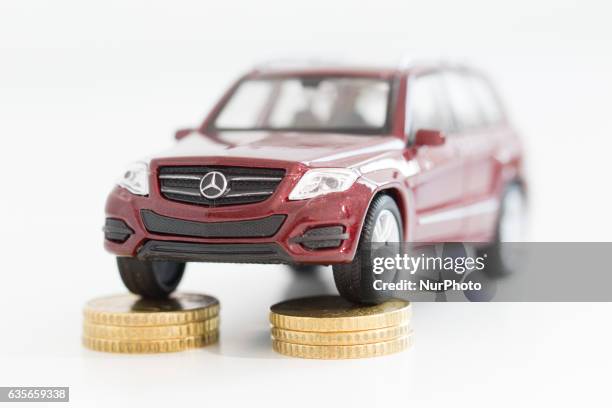 Model car is seen with Euro currency units.