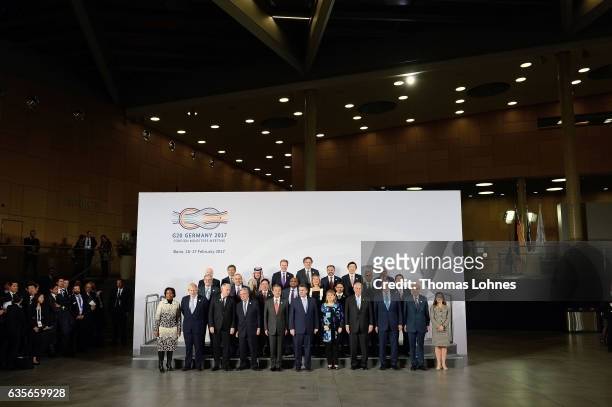 Representatives of the G20 countries pose for a family photo together at the G20 foreign ministers' meeting on February 16, 2017 in Bonn, Germany....