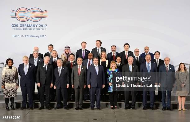 Representatives of the G20 countries pose for a family photo together at the G20 foreign ministers' meeting on February 16, 2017 in Bonn, Germany....