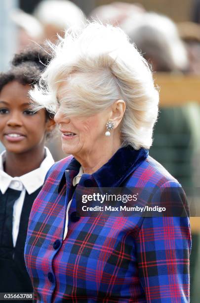 Camilla, Duchess of Cornwall's hair is blown in the wind as she visits the Ebony Horse Club riding centre to celebrate the club's 21st anniversary on...