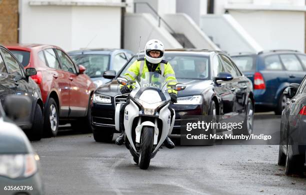 Metropolitan Police Motorcycle Outrider of the Special Escort Group leads the convoy transporting Camilla, Duchess of Cornwall in her Audi Car as she...