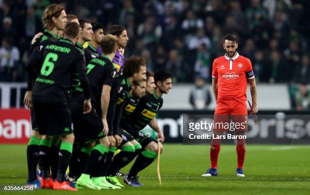 Gonzalo Rodriguez of Fiorentina is seen while players of Moenchengladbach pose for a picture during the UEFA Europa League Round of 32 first leg...