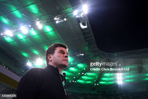 Borussia Moenchengladbach coach Dieter Hecking looks on during the UEFA Europa League Round of 32 first leg match between Borussia Moenchengladbach...