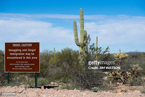 Sign warns against illegal smuggling in Organ Pipe Cactus National Monument near Lukeville, Arizona, on February 16 on the US/Mexico border. -...