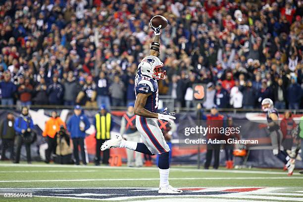 Malcolm Mitchell of the New England Patriots reacts after scoring a touchdown during a game against the Baltimore Ravens at Gillette Stadium on...