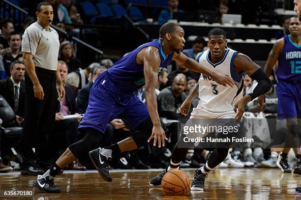 Kris Dunn of the Minnesota Timberwolves guards against Rasheed Sulaimon of the Charlotte Hornets during the preseason game on October 21, 2016 at...