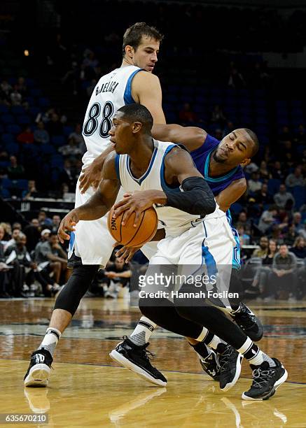 Nemanja Bjelica of the Minnesota Timberwolves sets a pick for Rasheed Sulaimon of the Charlotte Hornets as teammate Kris Dunn drives to the basket...