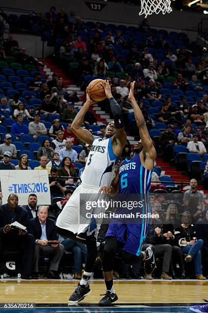 Kris Dunn of the Minnesota Timberwolves shoots against Rasheed Sulaimon of the Charlotte Hornets during the preseason game on October 21, 2016 at...