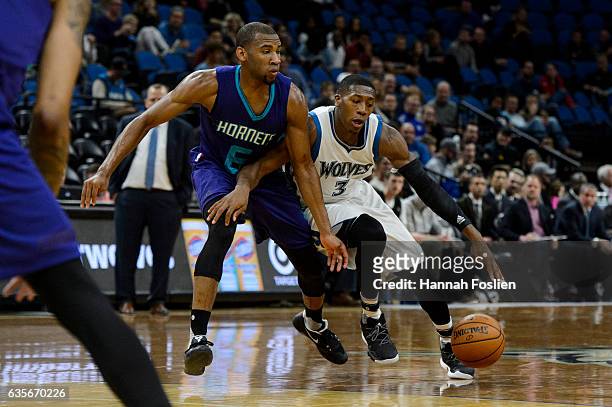 Kris Dunn of the Minnesota Timberwolves drives to the basket against Rasheed Sulaimon of the Charlotte Hornets during the preseason game on October...