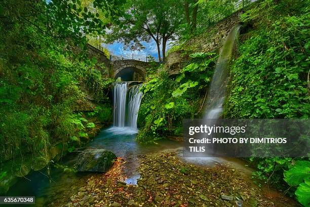 small stone bridge & waterfalls - dimitrios tilis stockfoto's en -beelden