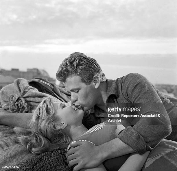 Italian actress Marisa Allasio kissing Italian actor Renato Salvatori in a scene from the film 'Marisa'. Rome , 1957