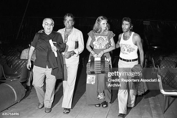 The Italian actor, comician and TV host Walter Chiari and the actors Sylva Koscina, Alberto Lupo and Carlo Campanini walking inside a theatre during...