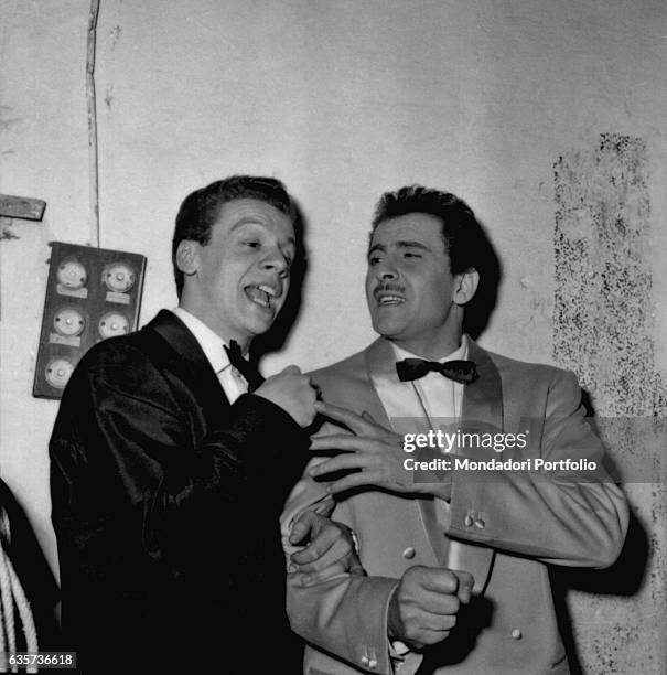 The singers Johnny Dorelli and Domenico Modugno pretending to singing happy after they won the 8th Sanremo Music Festival with the song Nel blu...