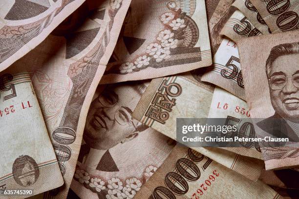 stack of north korean 5000 won notes - democratic peoples republic of korea stock pictures, royalty-free photos & images